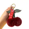 Colgante de Peluche de Conejo Rex Real con Cerezas Adornos Accesorios para Bolsos de Celebridades de Internet Llavero de Bola de Peluche Linda Accesorios