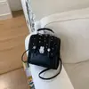 Bolsa transversal de alta qualidade com textura para mulheres 2026 nova tendência da moda versão coreana mochila bolsa de mão feminina mochila com toque de alta qualidade