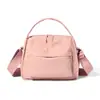 Bolsa de mão de nylon da moda, estilo coreano e japonês, nova para primavera-verão, bolsa de ombro para viagem, compras e trabalho, bolsa transversal para homens e mulheres
