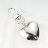 Ins Coreano Dulce Chica Cadena de Corazón Plateado con Lazo Colgante para AirPods Llavero de Chica Decoración Colgante para Bolso