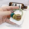 Versión coreana de color caramelo para mujer m frijoles atados goma para coleta cuerda para el pelo red popular simple cuerda para el pelo bola tocado de cuero venta al por mayor