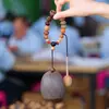Cascabel Campana de Mano Carrillón Colgante de Bolsa Hecho a Mano Rayo de Sonido Cascabel Colgante Fruta Negra Indonesia Cáscara Fábrica Venta al por Mayor