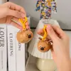 Chaveiro Criativo de Desenho Animado Capivara Voadora Boneca Casal Capivara Pingente Divertido para Mochila Pequeno Presente