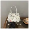 Bolsa de axila de lunares para dropshipping transfronterizo 2026 verano nueva moda bolso de mano casual estilo coreano bolso pequeño bolso tipo empanada
