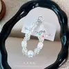 Cadena de teléfono colorida de acrílico hecha a mano con cuentas, charm de oso helado, exquisito accesorio para bolso, un pequeño regalo para parejas