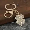 Venta Caliente Transfronteriza Aleación Creativo Completo Diamante Trébol de Cuatro Hojas Llavero Colgante Moda Bolso Colgante Accesorios Llavero