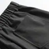 Pantalones casuales plisados de estilo americano para calle, fluidos, con diseños de moda, bolsillos únicos, color liso y corte holgado de pierna ancha para hombre.