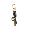 Llavero tejido a mano de fábrica hebilla de puerta accesorios cuerda de cuero versátil retro accesorios de colgante semiacabados para DIY