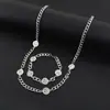 Collar de cara sonriente de alegrías y penas acero de titanio no se decolora hombres y mujeres pareja hip hop diseño de nicho punk cadena para la clavícula accesorios