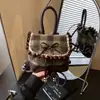 Bolsa Feminina de Xadrez de Alta Qualidade Outono/Inverno Transfronteiriça 2026 Nova Moda Laço Estilosa Versátil Mini Mochila Tendência
