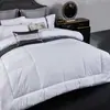 Calidad de hotel cinco estrellas, 100% algodón, impermeable, relleno de plumón, diseño a cuadros, edredón de invierno, engrosado, blanco puro, adecuado para casas de huéspedes