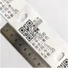 Etiqueta de cama de corte térmico en blanco etiqueta de impresión resistente al desgarro etiqueta colgante papel impresión de código de barras etiqueta colgante de número de corbata de ropa