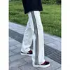 Pantalones a rayas rectos holgados versátiles de moda para hombre al por mayor de fábrica para otoño, pantalones deportivos juveniles para hombre