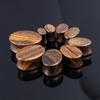 AliExpress madera de sándalo dorado de alta densidad Ovalado tronco expansión de oreja tendencia europea y americana joyería de perforación exclusivo transfronterizo