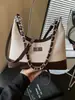 Bolso de mano pequeño de moda para mujer, nuevo bolso de cadena popular primavera-verano 2026, exquisito bolso de hombro y cruzado
