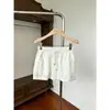 Falda casual de ajuste holgado con cintura elástica para mujer, nuevo estilo de verano, falda corta versátil de línea A con cordón anti-exposición