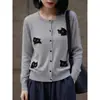 Roupas femininas transfronteiriças 2026 início do outono novo lã moda francesa versátil estampa integral jacquard de gatinho cardigã de tricô gola redonda