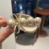 Pinza para el cabello con forma de lazo, pedrería y perlas, diadema, pasador dulce para mujer, elegante y refinado, nuevo pasador para la parte trasera de la cabeza