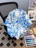 Camisa de Praia Floral Azul de Verão Estilo Sanya Hawaii Férias Preguiçosa Retro Solta Camisa para Casal