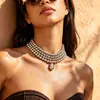 Collar de cruz con borlas y perlas de imitación cadena para la clavícula con sensación exagerada de nicho de alta gama moda de lujo ligero europeo y americano