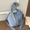Bolso cubeta de diseño de nicho transfronterizo, bolso cruzado de mezclilla, bolso de mujer 2026 versión coreana, bolso de mano/bolso de hombro artístico y moderno