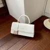 Bolso pequeño cuadrado tejido de color liso estilo europeo y americano con asa corta, tapa abatible y diseño de cierre, versátil para uso diario, bolso de mujer de un solo hombro o cruzado