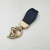 Llavero de patrón de cocodrilo mediano y corto llavero avanzado colgante de metal accesorios de llavero de moda fábrica de regalos al por mayor