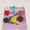 Venta al por mayor de fabricantes de crisantemos y margaritas artificiales pequeñas para decoración del hogar, horquillas hechas a mano para bricolaje, accesorios de decoración de ropa con flores