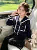 Ropa de Otoño para Niñas Transfronteriza Suéter con Cuello Marino Conjunto de Pantalones Negros de Microcampana Nuevo Conjunto de Dos Piezas Campus 2026 Ropa Infantil de Moda