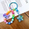 Llavero de Patita de Gato con Arena Líquida y Cuentas Colgante para Mochila de Estudiante Decoración para Llavero de Coche Muñeco Máquina Regalo Pequeño Venta al por Mayor