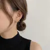 Aretes de botón con cuatro garras incrustados de diamantes diseño de nicho sentido del temperamento aretes de plata estilo nuevo alta gama moda joyería de oreja versátil para mujeres