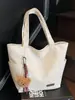 A Bolsa Sacola Casual e Simples Popular Deste Ano para Sala de Aula de Estudantes é uma Bolsa de Ombro Leve da Moda de Grande Capacidade Estilo Executivo para Mulheres
