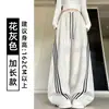 Pantalones de chándal anchos de rayas diagonales americanas azul oscuro para mujer Otoño 2026 Nuevos Simples Versátiles Sueltos Adelgazantes Pantalones Banana