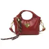 Mini bolso triangular transfronterizo para mujer, bolso de pintalabios de nicho de moda europea y americana para el día a día, bolso cruzado para niños, moderno