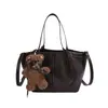 Bolso tipo cubo suave y cómodo para mujer, nuevo diseño de nicho estilo coreano 2026, adecuado para el trabajo y para llevar cruzado.