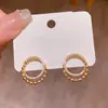 Pendientes de botón geométricos de círculo pavimentados con circonita, versátiles de lujo ligero, pendientes de moda de alta gama con temperamento transfronterizo, joyería para el oído, venta al por mayor