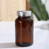 Garrafas de cápsula de vidro âmbar de 60ml para atacado, garrafas seladas à prova de luz para reagentes, vitaminas para cuidados com a saúde e produtos de bem-estar, garrafas vazias para dispensar