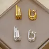 Pendientes de aro de línea multicapa de alta gama de venta caliente transfronterizos europeos y americanos Pendientes geométricos de oro de 18 quilates Joyería de estilo frío Venta al por mayor
