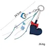 Encanto de teléfono de corazón de cuero con lazo único y elegante, encanto para bolso con corazón de píxeles chapado en colores dulce y genial