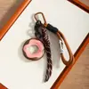 Novo Pingente de Bolsa Quente Transfronteiriça, Pingente de Chaveiro, Pingente de Cordão para Celular, Cor Maillard de Couro de Rosca