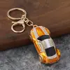 Llavero de coche deportivo con incrustaciones de diamantes en stock, colgante creativo de modelo de coche de esmalte, accesorio para bolso de mujer, artículo promocional