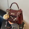 Bolso de mujer personalizado, bolso de hombro versátil para mujer con estampado de piedra, nuevo bolso de mano de moda de invierno, bolso Kelly retro a la moda