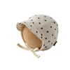 Sombrero de Bebé Coreano Qiunan Primavera 2026 Nueva Moda Correa a Prueba de Viento Protección para Orejas de Bebé Sombrero de Bebé