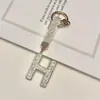 Pingente de chaveiro de carro com 26 letras em inglês cravejado de diamantes transfronteiriço, decoração de bolsa com strass de argila, atacado de chaveiro de celular