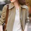 Lleno de aura, intelectual y de espíritu libre, adelgazante y adecuado para todos, con un cinturón entallador, gabardina de estilo moderno para mujer
