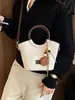 2026 Otoño Temprano Nuevo Bolso de Hombro Elegante de Nicho de Alto Valor Bolso de Mano Moderno Simple de Color Sólido Tipo Cubo Cruzado