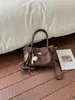 Bolso pequeño vintage transfronterizo para mujer, modelo nuevo 2026, bolso tipo cubo de alta gama, bolso cruzado de moda para el día a día