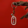 Venta al por mayor de fabricante de joyería nueva del Tíbet: Llaveros de aleación vajra con marco cuadrado, colgantes para bolsas y adornos para coche