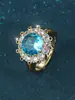 Anel Grande com Pedra Principal Retro Europeu e Americano Venda Quente Transfronteiriça Flor de Sol Dourada Zircônia Azul Inlaid Pulseira Ajustável