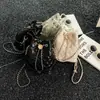Elegante y versátil bolso tipo cubo con cadena de patrón de rombos, nueva moda 2026, bolso de hombro y bandolera a la moda estilo Chanel para mujer